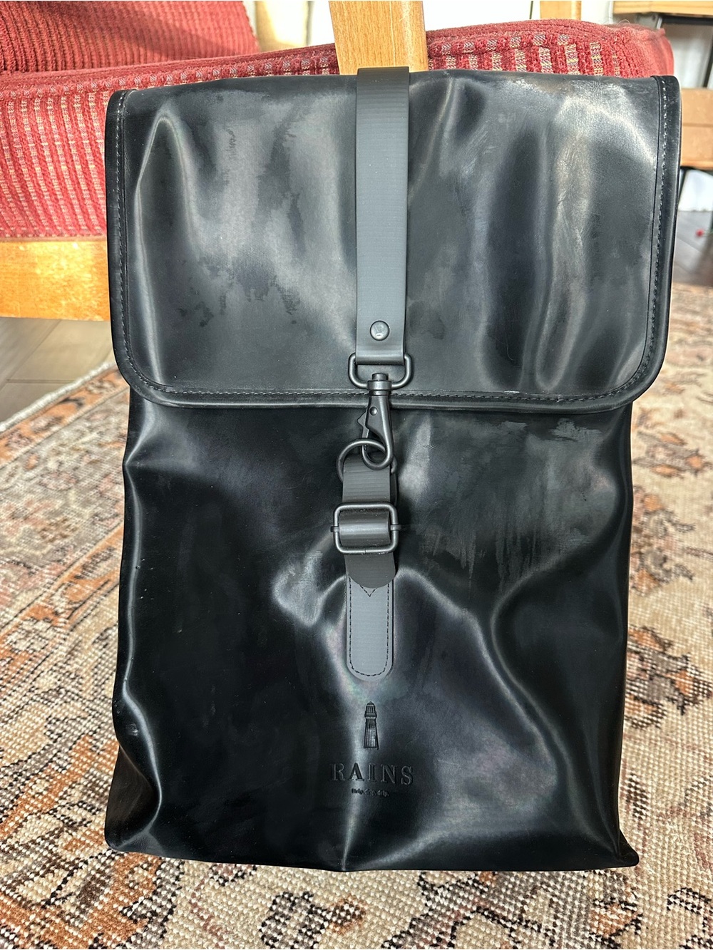 Rains Black Backpack with buckle closure
